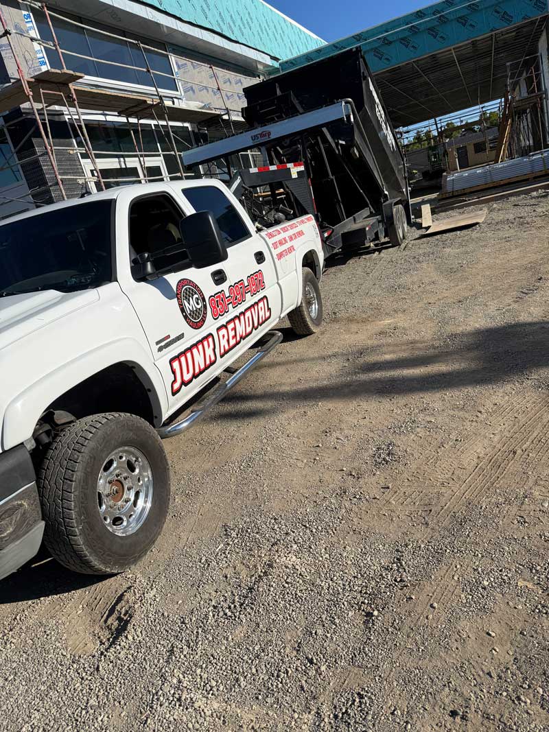 MG Transportation crew hauling junk from a property