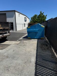 Blue container in commercial yard, demonstrating services in Hollister CA